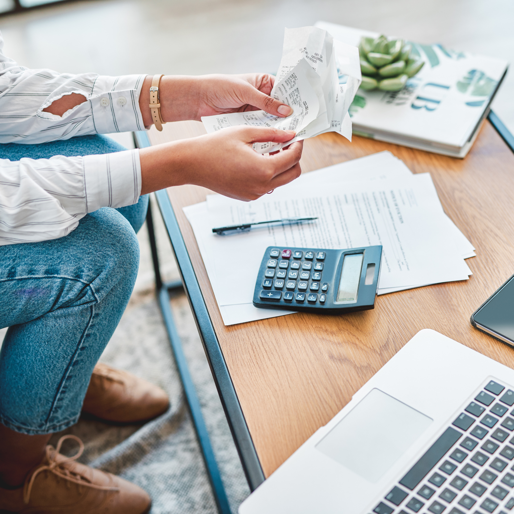 Business owner holding receipts